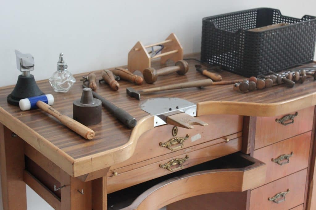 a wooden workbench with tools on top of it
